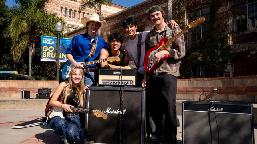 South of Sober band members posing with guitars and amplifiers at UCLA